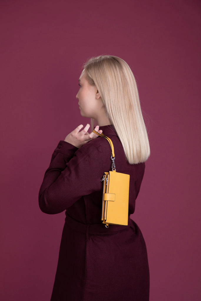 Oranssin savyinen nahkainen puhelinlompakko Utua