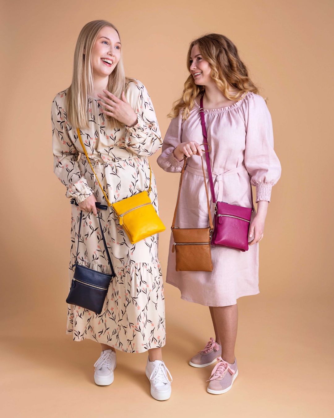 utua pisara musta pikkulaukku nahkaa